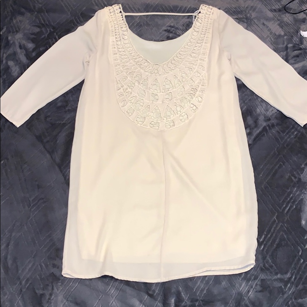 Cream dress with crochet detailing on back